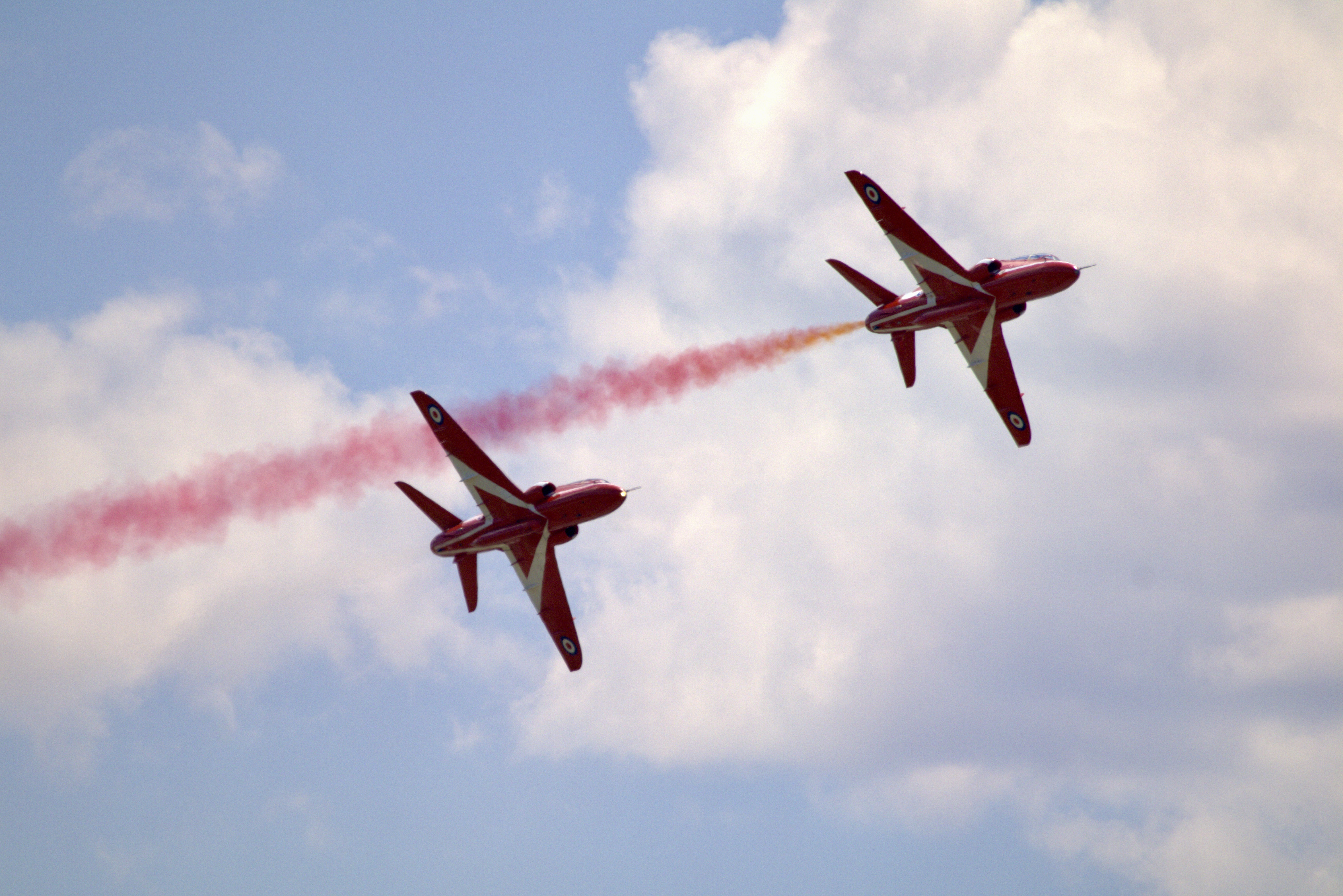 2 Red Arrows, one with red smoke